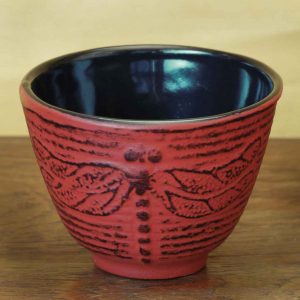 cast iron tea cup with dragonfly