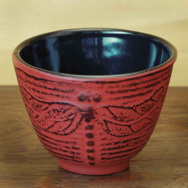 cast iron tea cup with dragonfly