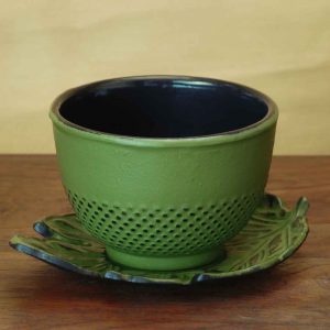 cast iron teacup and saucer
