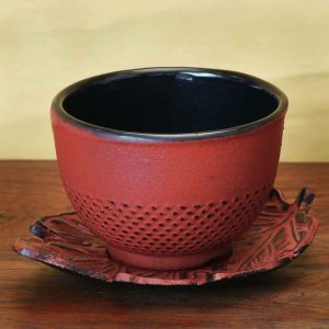 cast iron tea cup and saucer