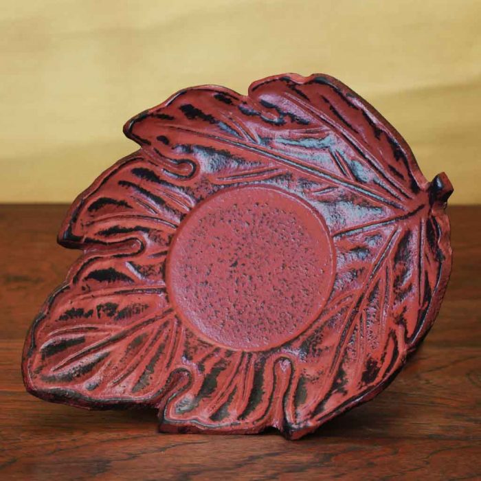 cast iron tea cup and saucer